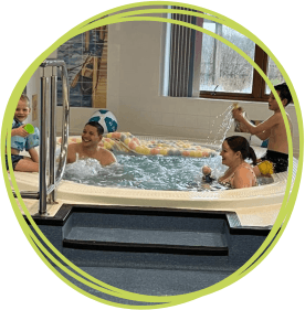 Sam and his family in the hydrotherapy pool at Little Harbour